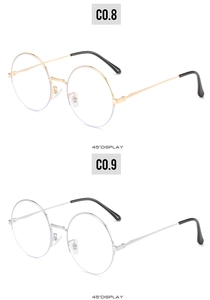 Detailed 45-degree view of gold and silver round metal frame vintage sunglasses