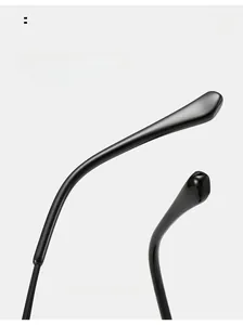 Detail of curved glossy black sunglasses legs designed for ergonomic comfortable wear
