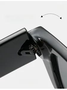 Macro shot of durable polished metal hinges on stylish square black frame sunglasses