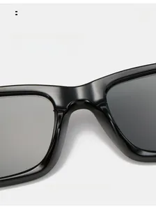 Detail of comfortable ergonomic nose pads on glossy black square oversized sunglasses