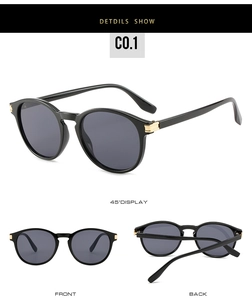 Vue détaillée de lunettes de soleil rondes rétro avec monture noire et détails dorés