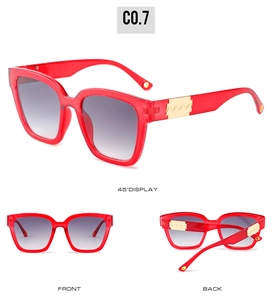 Multi-angle view of red square sunglasses with gold wavy metal details and grey lenses