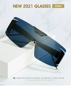 Macro detail of oversized shield sunglasses with blue gradient lenses and gold metal temples