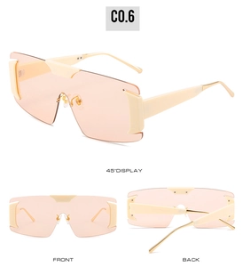 Three-way view of peach oversized rimless sunglasses with gold metal temples