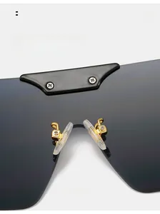 Detail of comfortable silicone nose pads on gold metal oversized sunglasses