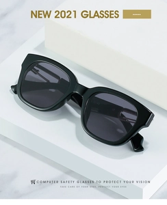 Macro view of square black sunglasses frame featuring the 023-143 model code on the temple