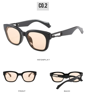 Detail view of square frame sunglasses with orange lenses and hollow metal hinges