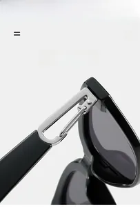 Close-up of durable metal hinge on black square oversized trendy sunglasses