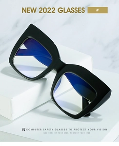 Detail of oversized black cat-eye eyeglass frames with anti-blue light coating technology
