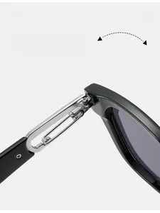 Detail of durable metal hinge on black square sunglasses with reinforced structure