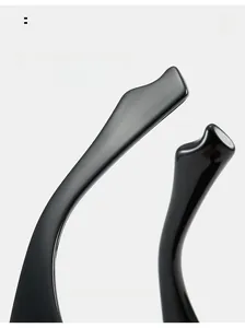 Macro view of ergonomic curved glossy black resin glasses temples for maximum comfort