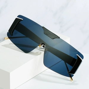 Fashion oversized one-piece sunglasses with deep blue lenses and gold metal temples