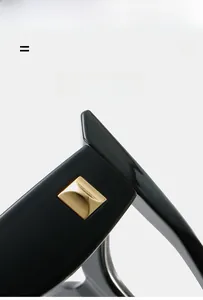 Close-up of cat-eye glasses frame featuring gold metal rivet hinge and texture material