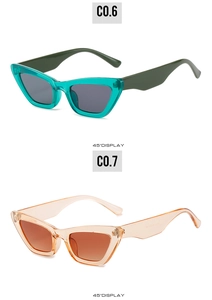 Detailed 45-degree view of narrow cat-eye sunglasses in cyan and orange transparent frames