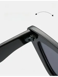 Detail view of durable metal hinges on glossy black cat-eye sunglasses frames