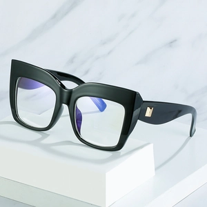 Chic black oversized cat-eye glasses with gold rivet accents and blue light lenses