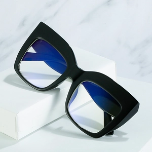 Chic black oversized square cat eye glasses frame on elegant marble background