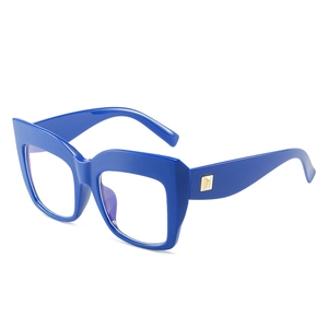 Oversized navy blue cat-eye glasses with gold temple accents on white background