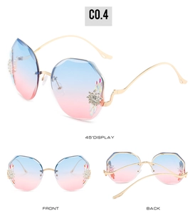 Vue détaillée de lunettes de soleil sans monture avec verres dégradés et strass floraux