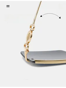 Detailed macro view of durable golden metal hinges and textured joint on square sunglasses