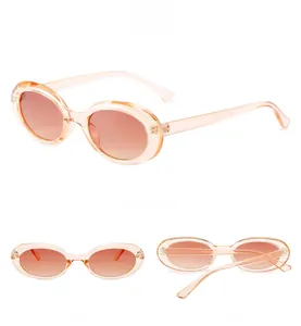 Three views of oval vintage sunglasses with champagne gold frames and tea gradient lenses