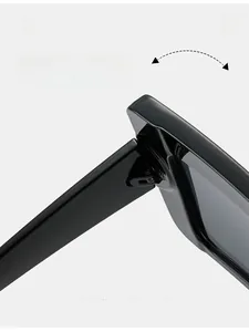 Vue macro d'une charnière métallique durable sur des lunettes de soleil punk noires