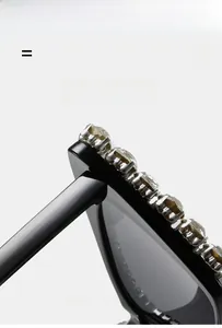 Detail of cat eye sunglasses featuring sparkling rhinestones on lightweight black frames