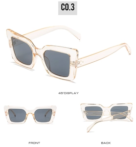 Three angles of champagne cat-eye sunglasses with metal rivets and dark gray lenses