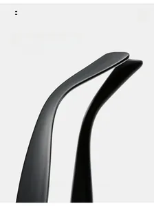 Detail of curved ergonomic temple tips on matte black cat-eye sunglasses for comfortable wear