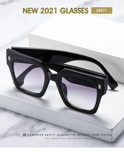 Macro view of gradient purple lenses and silver metal hinges on square frame sunglasses