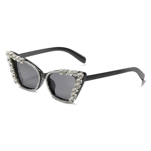 Cat eye sunglasses with oversized black frame and sparkling rhinestone chain trim
