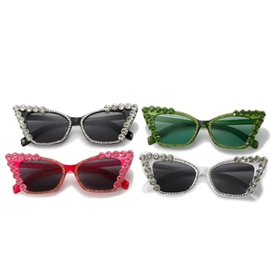 Cat eye sunglasses for women with rhinestone chains in black, pink, green, and white