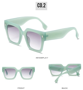 Detail view of square green sunglasses featuring metallic rivets and gradient purple lenses