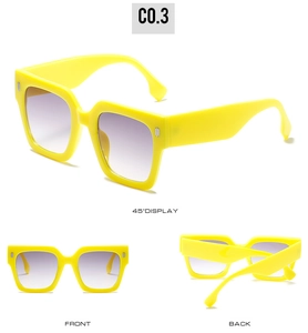Detail view of bold square yellow frame sunglasses with purple gradient lenses