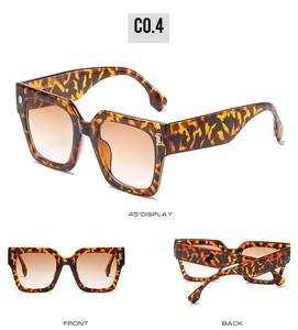Detailed views of oversized tortoiseshell square sunglasses with brown gradient lenses