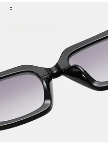 Macro view of square sunglasses featuring comfortable integrated nose pads and glossy frame