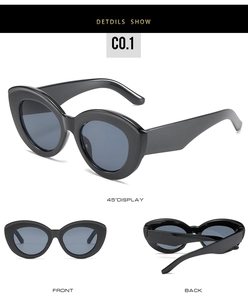 Macro detail of retro black cat-eye sunglasses with gradient grey-blue lenses