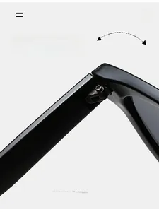 Close-up of durable metal hinges on glossy black sunglasses with precision screws