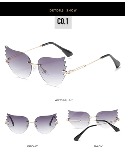Vue détaillée de lunettes de soleil sans monture en forme de flamme avec verres violets