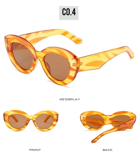 Three-way view of cat eye sunglasses in orange marble frame with tinted lenses
