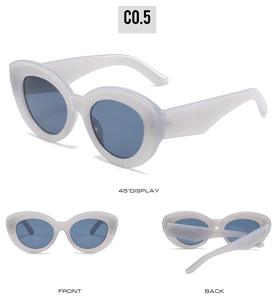 Three perspectives of retro thick cat-eye sunglasses with cream frames and blue lenses
