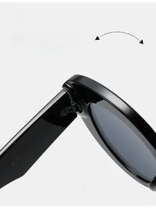 Detail of reinforced hinge and size code 52-22-146 on black cat eye sunglasses