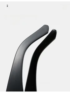 Detail of curved ergonomic matte black temples for oversized cat-eye sunglasses