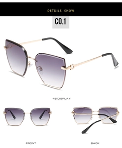 Detail view of rimless gradient purple lenses with gold metal temples and Gancini-style buckle