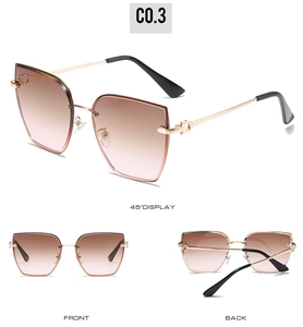 Detail view of rimless square sunglasses with gradient lenses and golden metal temples