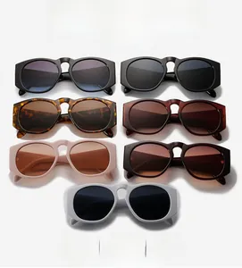 Collection of oversized round sunglasses in various colors like black, tortoise, and pink