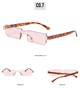 Detailed view of rimless pink rectangle sunglasses with gradient frame and tortoiseshell arms