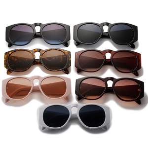 Set of stylish oversized round sunglasses in assorted colors on white background