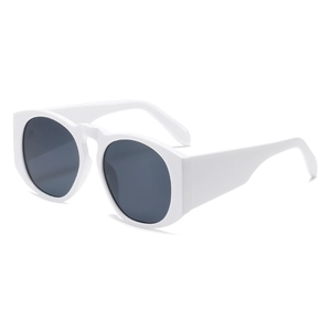 Modern white oversized round sunglasses with dark lenses shown at a 45-degree angle