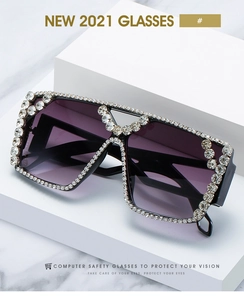 Close-up of oversized square sunglasses featuring premium crystal rhinestones and gradient lenses